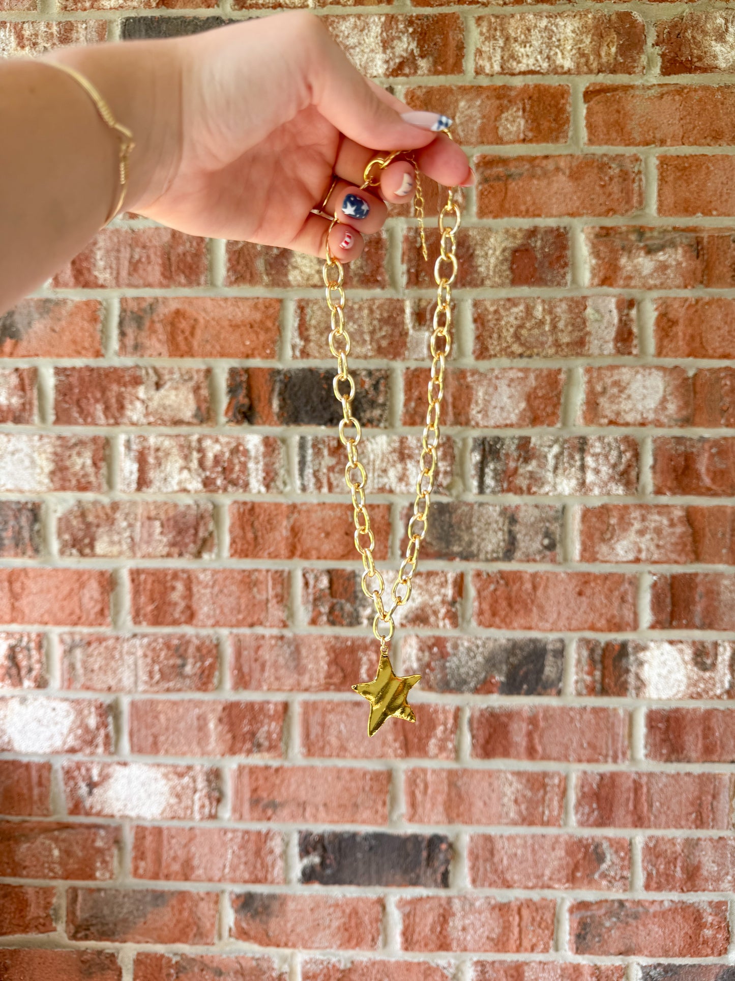 Gold breaded star necklace